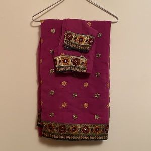 Magenta colored saree with matching stitched blouse